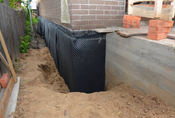 Happy homeowners after waterproofing job in Penns Grove